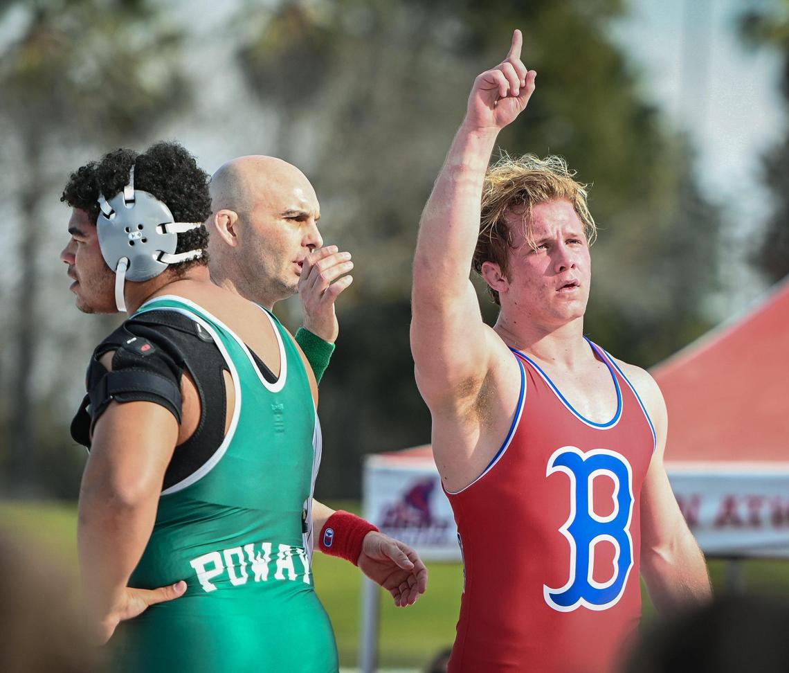 Buchanan’s Caden Rodgers, right, gets the win against Adam Farha of Poway in the 222-pound match during their meet at Veterans Memorial Stadium on Saturday, Feb. 5, 2022.