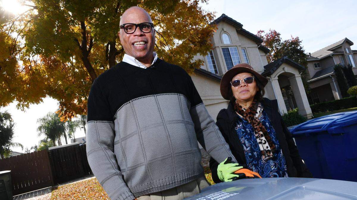 Michael Carter, left, with his wife Doreen Cometa-Carter, regularly commits random acts of kindness as he walks his Clovis neighborhood putting away neighbors’ trash cans each Monday. Michael estimates he covers over 400 houses taking up to five hours to complete the work.