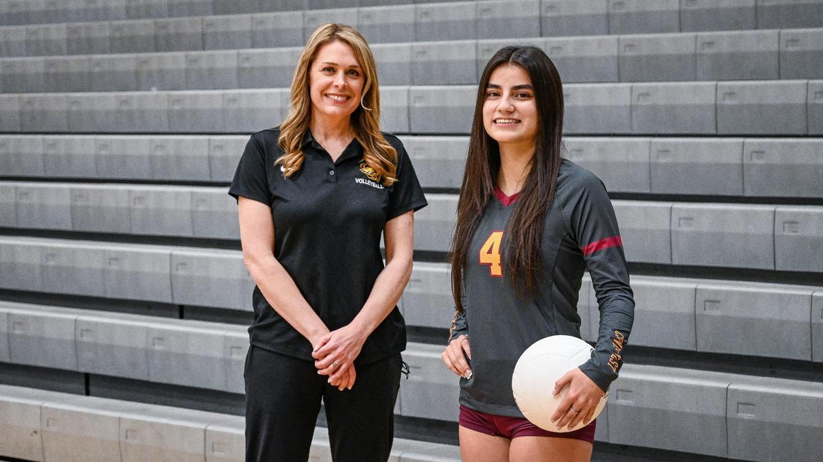 Clovis West volleyball coach Rhonda DeRuiter, left, The Bee’s Coach of the Year with Player of the Year Gabby Russell.