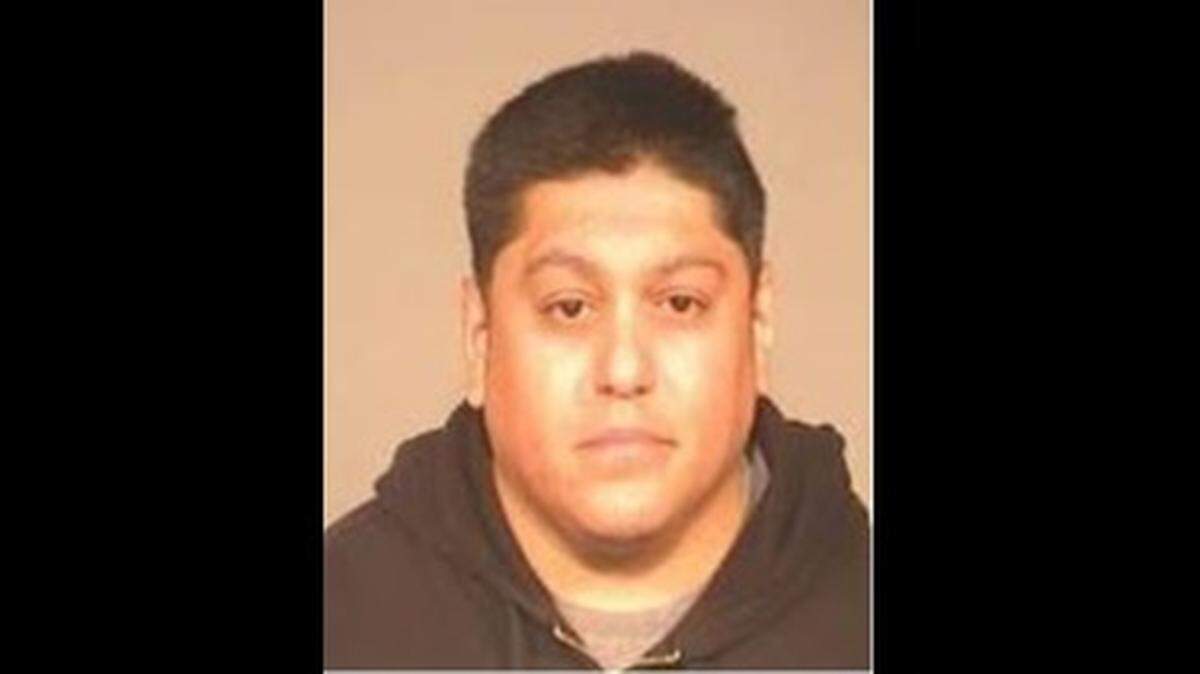 Raul Morales, 39, was allegedly repairing his pickup when he was arrested by detectives.