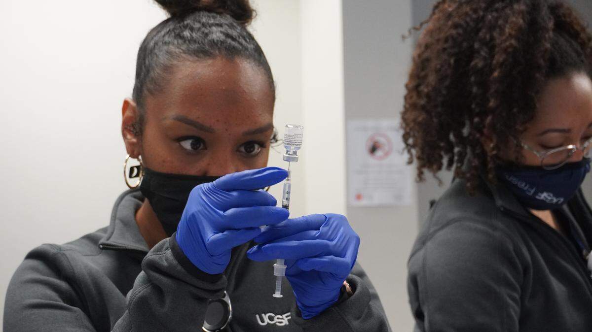 Corina Jefferson, medical assistant with UCSF Fresno CEP, draws a vaccine.