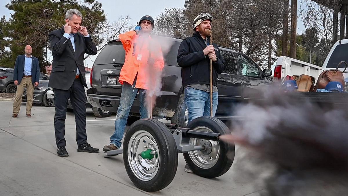 Speaker of the House, Republican Kevin McCarthy of Bakersfield, left, plugs his ears after igniting a ceremonial canon to officially kick off the 2023 World Ag Expo in Tulare during their opening ceremonies on Tuesday, Feb. 14, 2023.