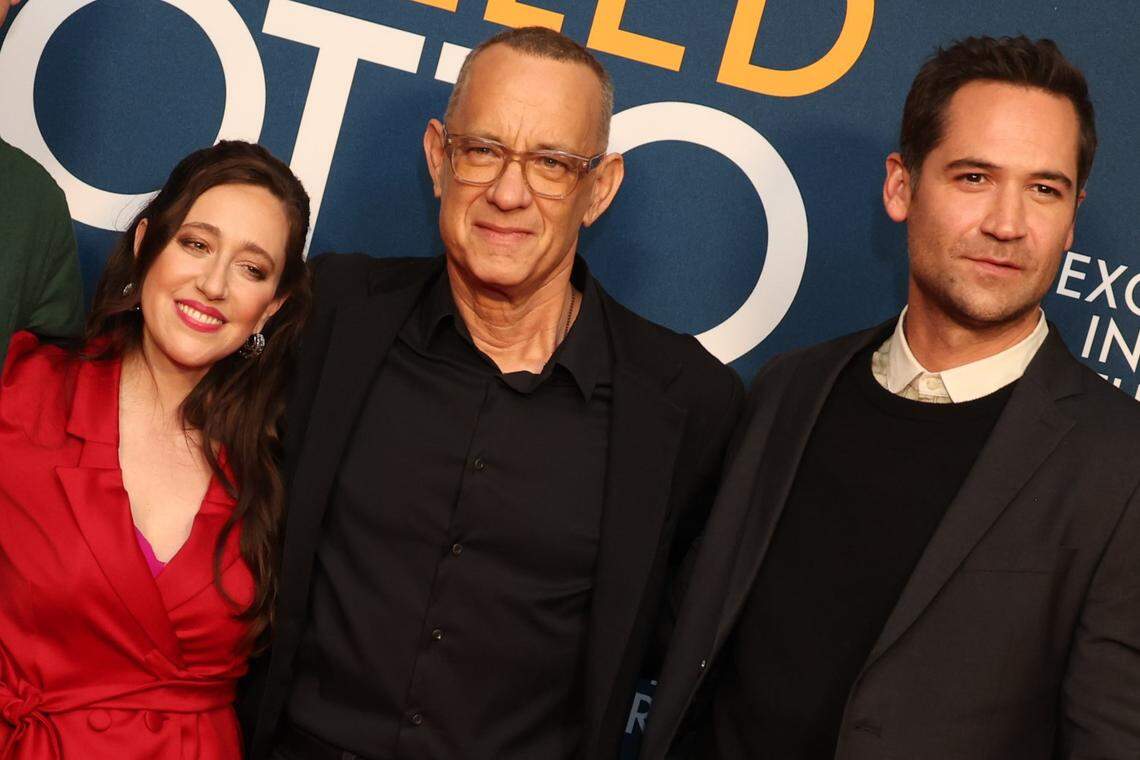 Mariana Treviño, Tom Hanks and Manuel Garcia-Rulfo attend a photo call for Columbia Pictures ‘A Mam Called Otto’ on Dec. 5, 2022, at the Academy Museum in Los Angeles.