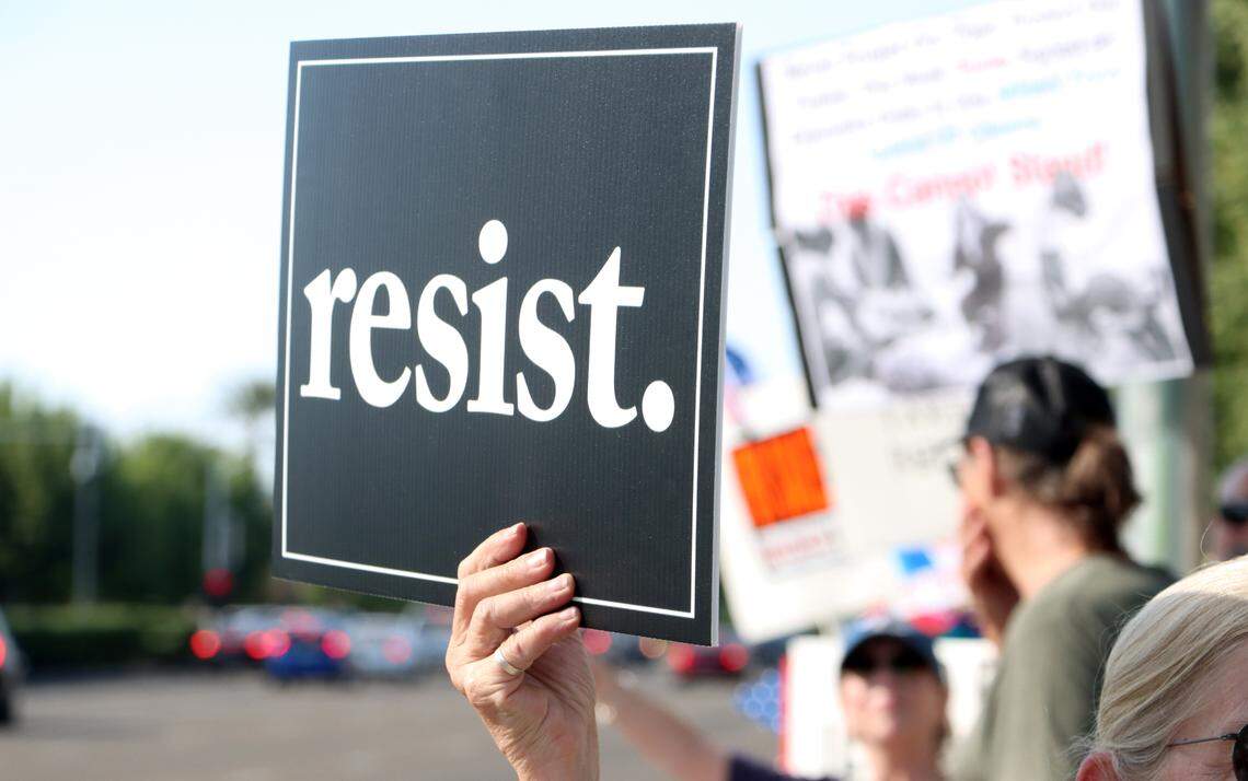 Several hundred protesters showed up on Blackstone near Alluvial in northeast Fresno to voice their opposition to various Trump administration actions on May 1, 2025.
