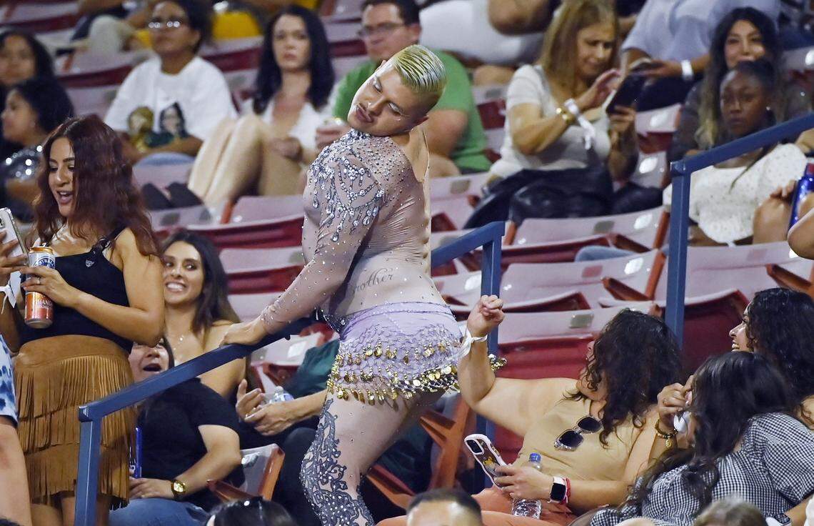 A fan works the stair rail for the crowd before Colombian singer Shakira took the stage for her sold out Las Mujeres Ya No Lloran World Tour show at Valley Children's Stadium, August 7, 2025 in Fresno.