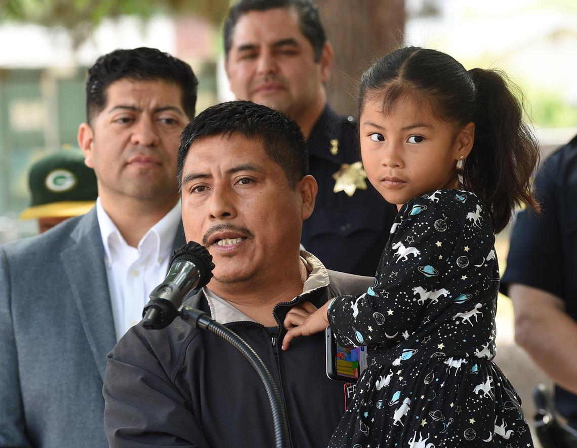 Fresno mobile street food vendor Miguel Lopez, with his 5-year-old daughter, Genesis, speaks during the press conference at the Mosqueda Center, Wednesday March 30, 2022, where the launching of a pilot program was announced for the safety of street food vendors who live and work in Fresno.