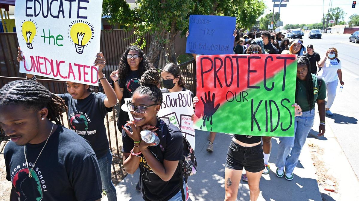 Hundreds of students march from Edison High along California Street to Friday’s Fresno Unified School Board assembly addressing a racist photo posted to social media earlier in the week at Bullard High. Photographed Friday, May 6, 2022 in Fresno.
