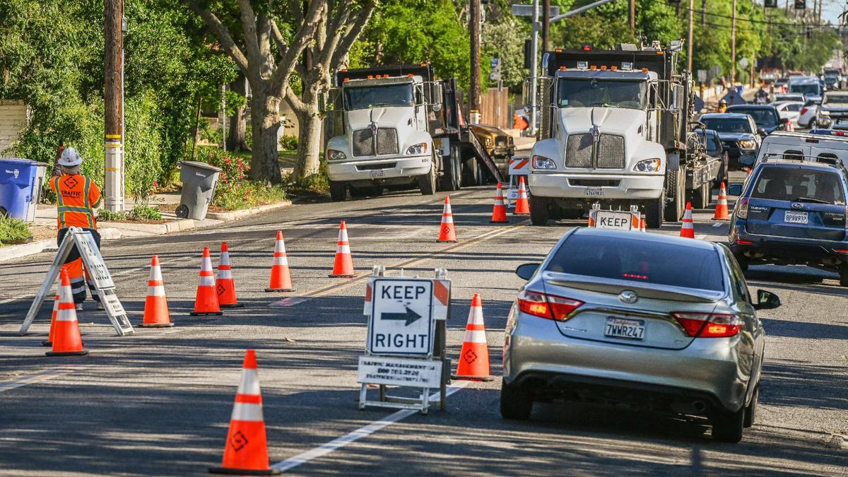 Orange cones are spread out along Palm Avenue south of Shields as workers prep the road for the installation of new Class IV bikeways.