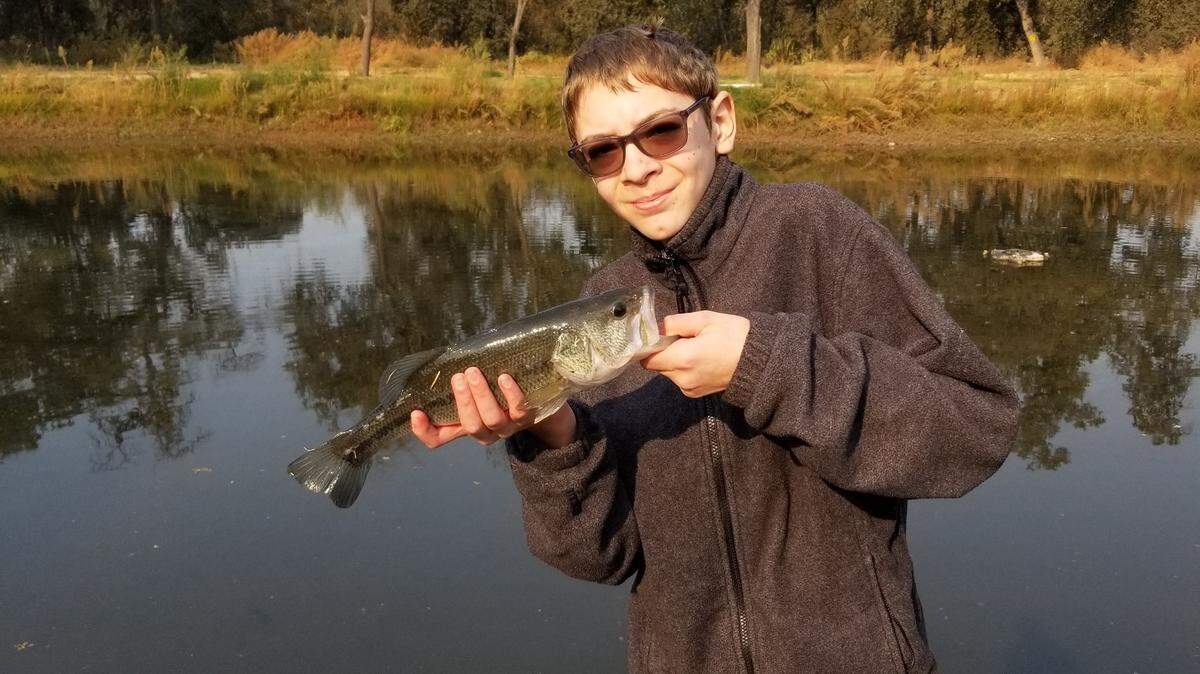 John Berg shares a snapshot of his son Jacob, 12, with a largemouth bass he caught Oct. 31 near the Kings River. “I am very proud of him for persevering because it had been three hours and nothing was biting. A quick change of lure and strategy was in order, and he adjusted his tactics, using a swimbait to hook the bass. It was very gratifying!”