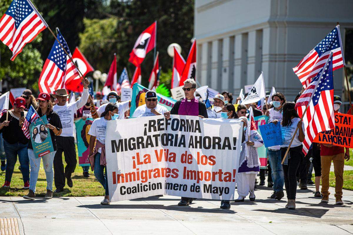 About 200 people marched through Courthouse Park in support of immigration reform during the May Day Rally on Sunday, May 1, 2022, in Fresno, California.