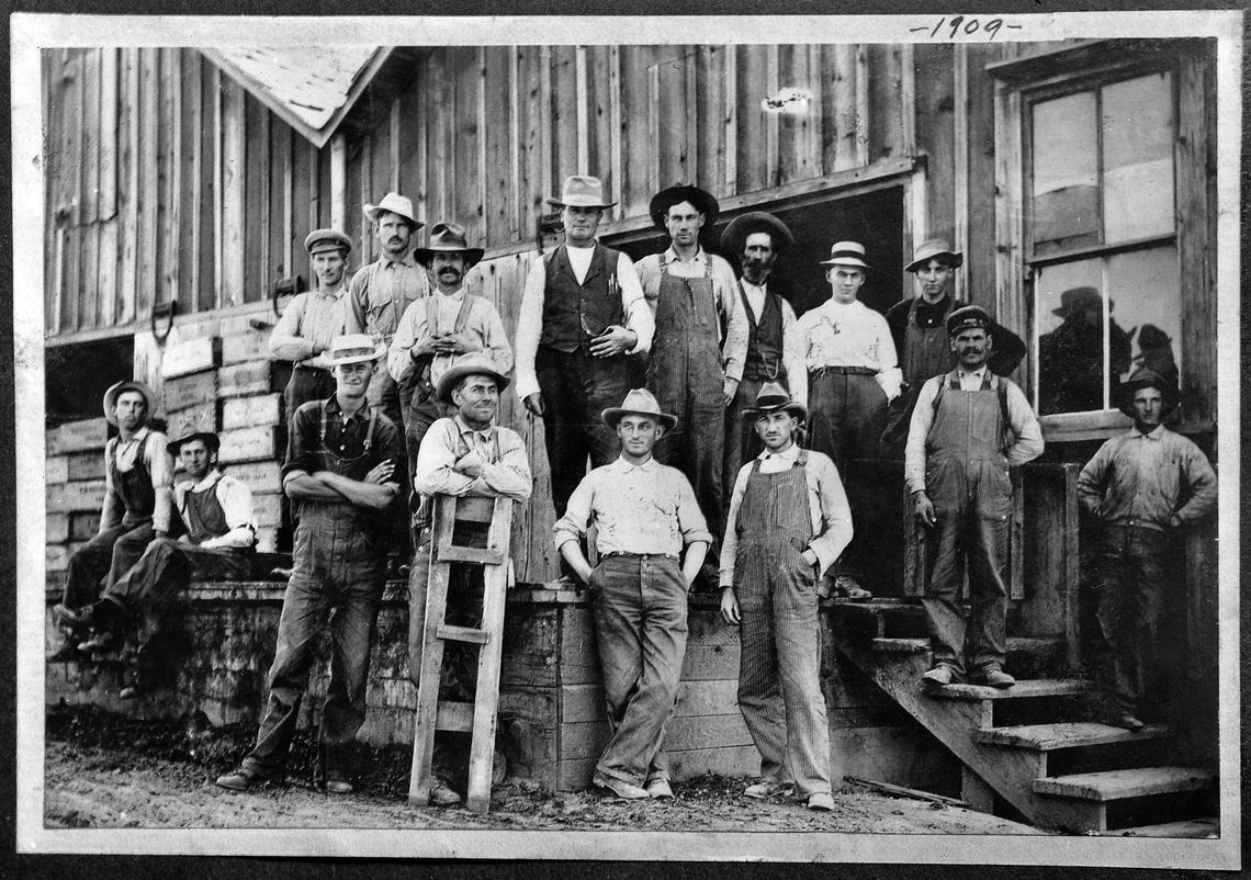 Sun-Maid workers in 1909 gather at a loading dock.