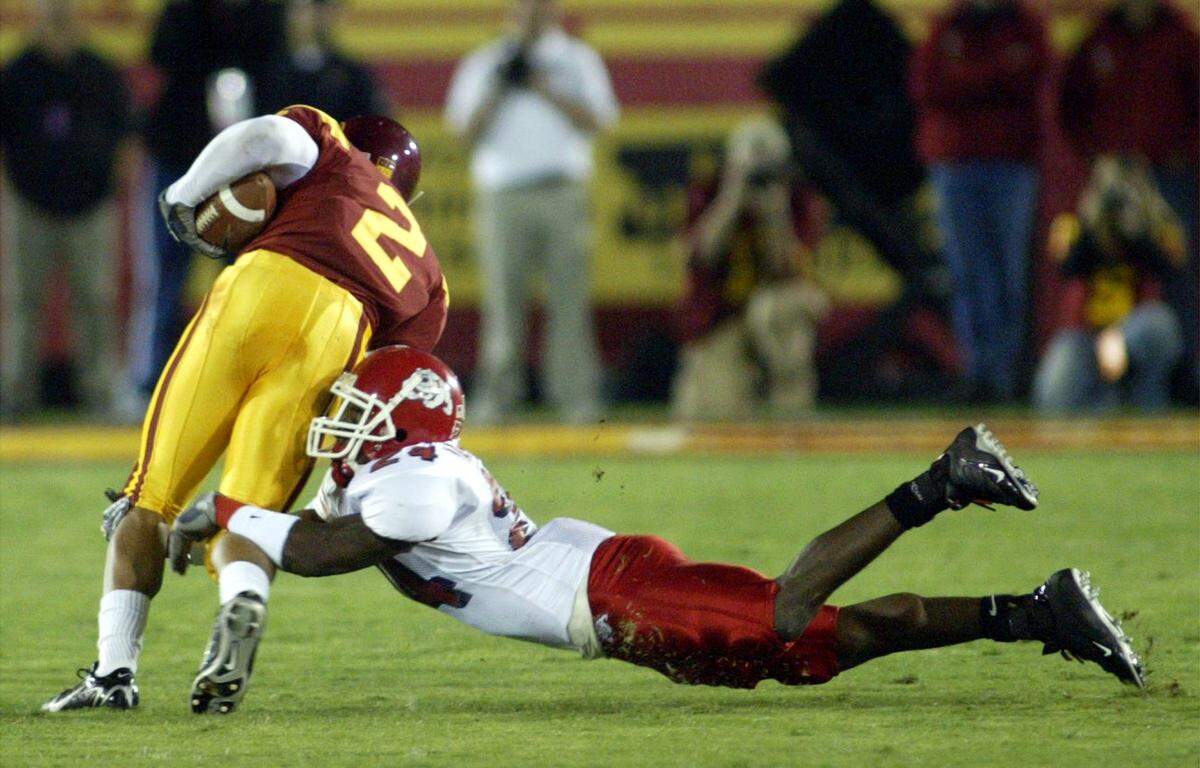 Fresno State's Richard Marshall tackles USC's Steve Smith during their game at the Los Angeles Memorial Coliseum on Saturday night November 19, 2005.