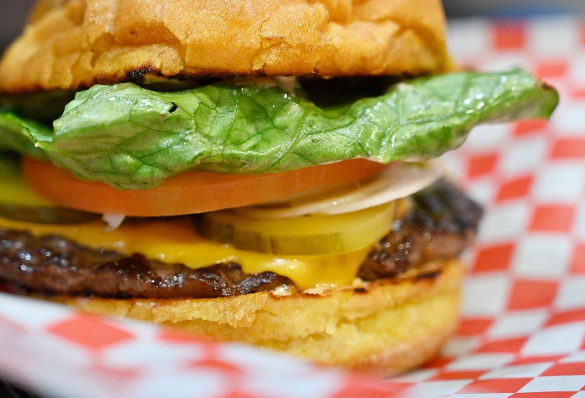 A classic burger with cheese featuring buttery toasted potato buns from Buttery Buns, an eatery just south of Fresno at Highway 99 and North Avenue. The restaurant and its sister eatery, Zeus Mediterranean, which share a dining room, won the Fresno Bee’s 2023 poll for best new local eatery.