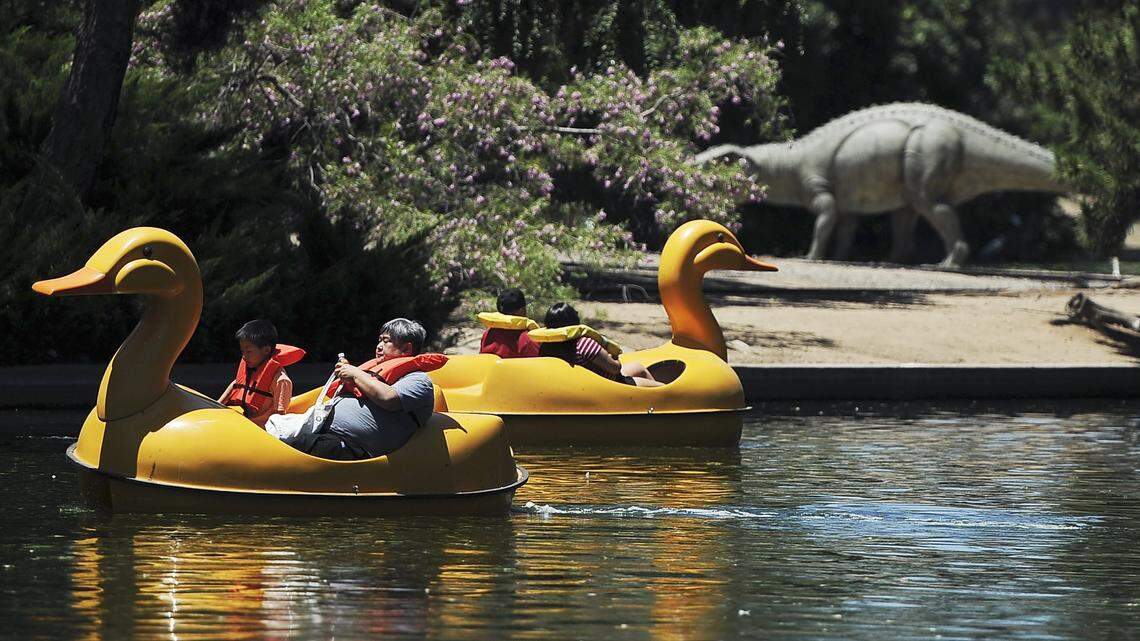 Boaters relax at Roeding Park Sunday afternoon, June 18, 2017 in Fresno, Calif.