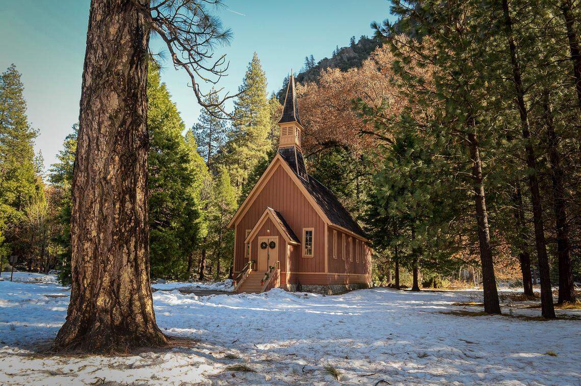 The Yosemite Valley Chapel is surrounded by a light dusting of snow on Monday, Dec. 9, 2019 after storms moved through the Yosemite National Park area over several days.