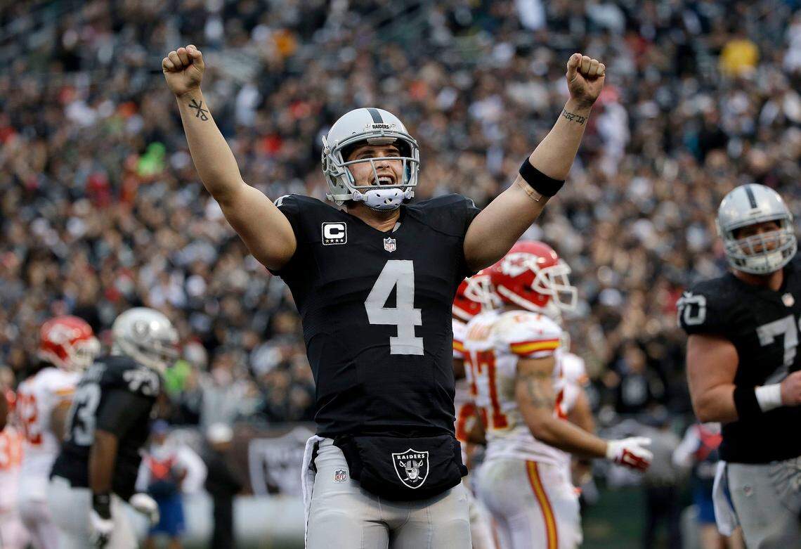 FILE - In this Dec. 6, 2015, file photo, Oakland Raiders quarterback Derek Carr (4) celebrates after throwing a touchdown pass to tight end Lee Smith during the second half of an NFL football game against the Kansas City Chiefs in Oakland, Calif. The Denver Broncos, who face Carr and the Raiders on Sunday, Dec. 13, 2015, are the only team in the NFL that hasn’t allowed a 300-yard passer so far. (AP Photo/Marcio Jose Sanchez, File)