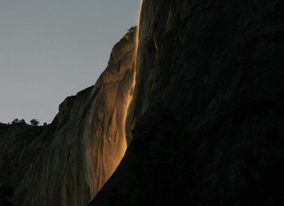 Water from Horsetail Falls is lit by the last light at sundown on Sunday, February 14, 2010 in Yosemite Valley in Yosemite National Park.