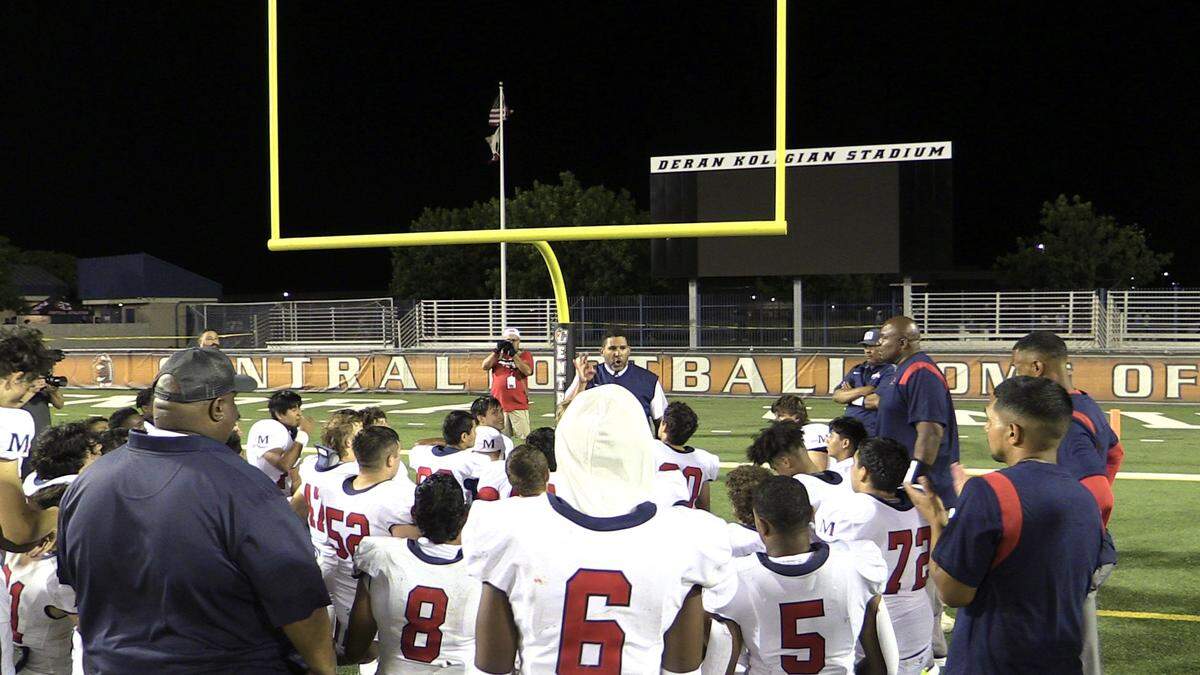 San Joaquin Memorial coach Anthony Goston talks to his team after a 23-21 victory over Central on Friday, Aug. 26, 2022.
