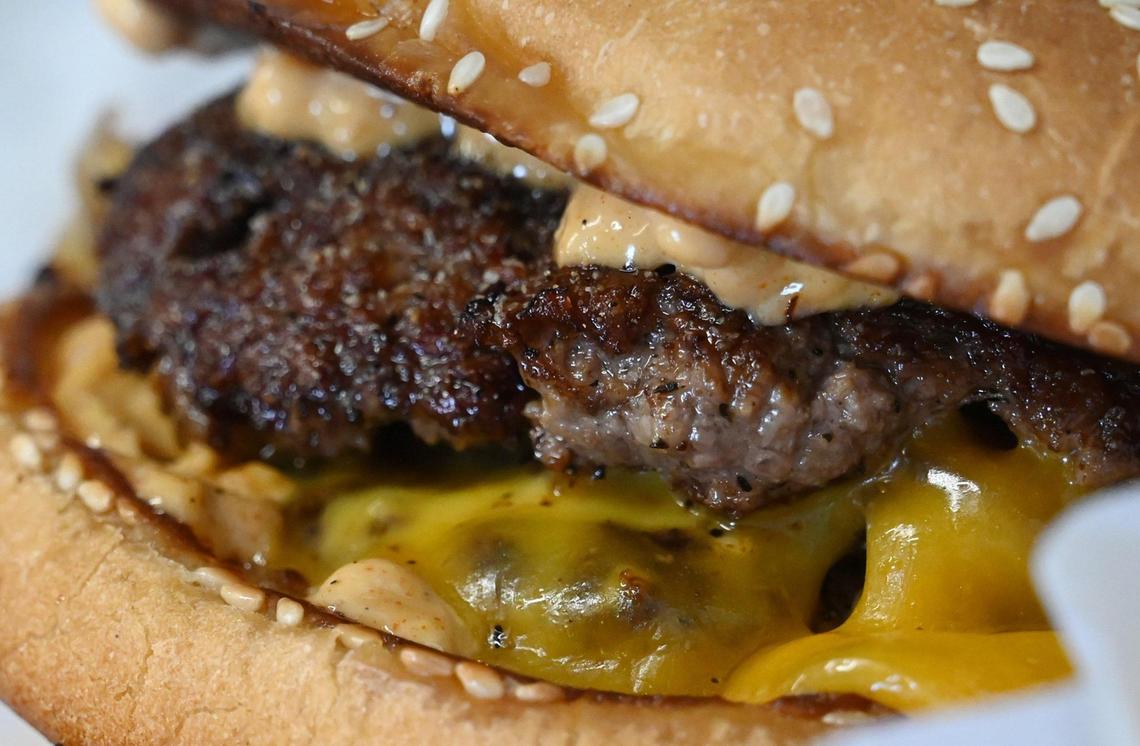 Smash burgers served with tater tots are favorite at Full Circle Brewing’s new food truck Full Circle Bistro. Photographed Saturday, Feb 4, 2023 in Fresno.