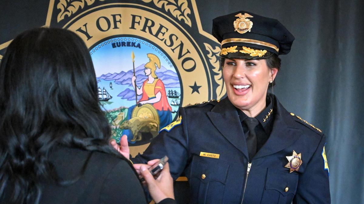 New Fresno Police Chief Mindy Casto takes photos with well-wishers following a swearing in ceremony held at the Saroyan Theatre in Fresno on Friday, Feb. 28, 2025.