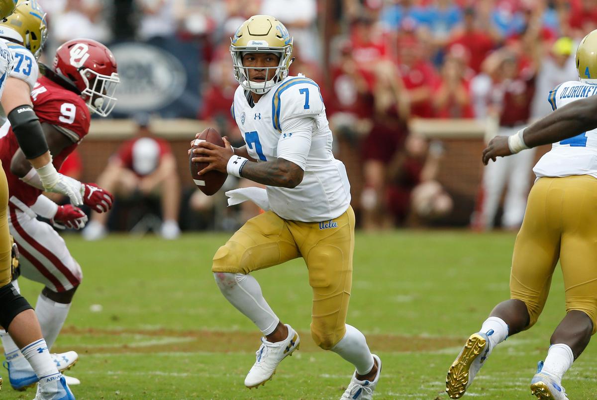 UCLA quarterback Dorian Thompson-Robinson (7) looks for an open receiver in the Bruins 49-21 loss at Oklahoma in Norman, Okla., Saturday, Sept. 8, 2018. Oklahoma is on California’s travel ban list, but the team traveled there because state funds were not expended.