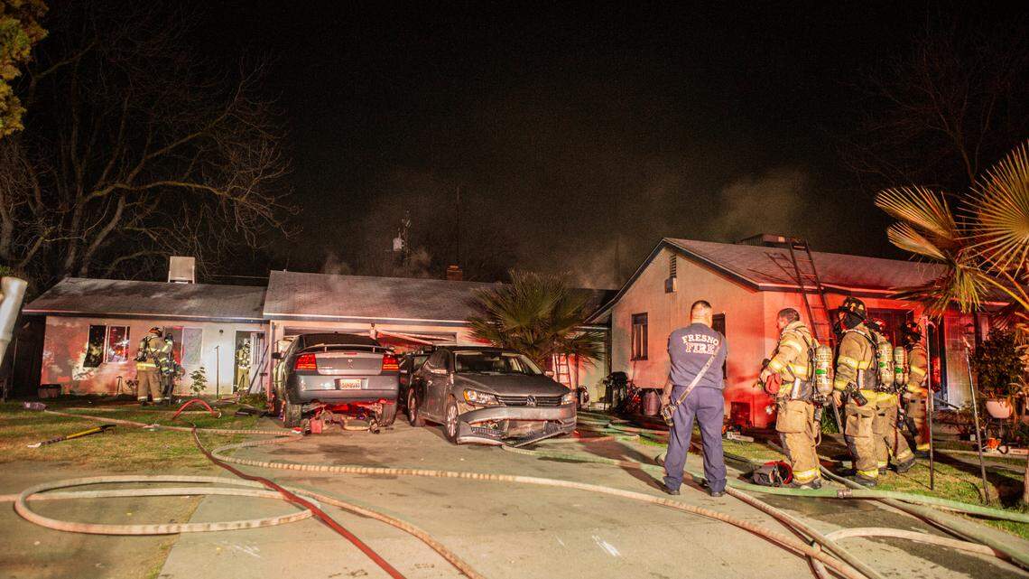 Fire crews respond to a two-alarm fire involving two homes in southeast Fresno on Thursday, Jan. 20, 2022.