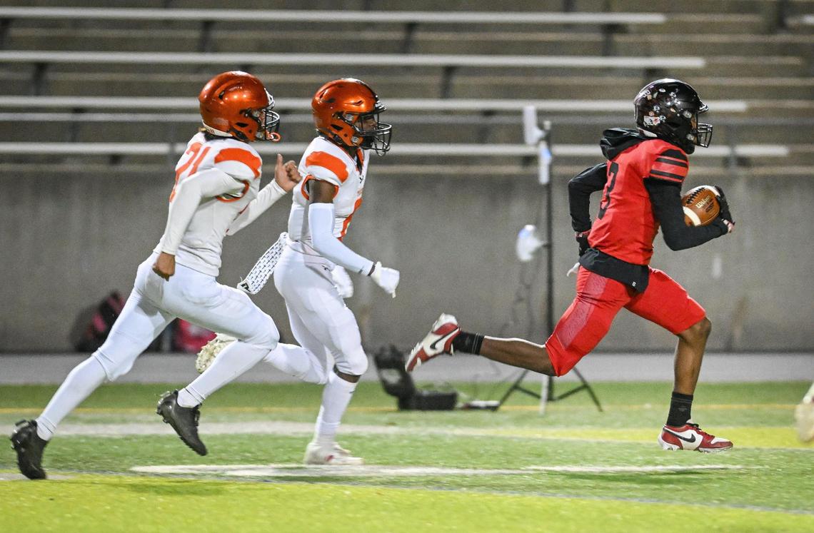 McLane wide receiver Julyen Scott runs the ball down the sideline on his way into the end zone for a touchdown against Wasco in the second half of their Central Section Division IV quarterfinal playoff game at McLane Stadium in Fresno on Friday, Nov. 8, 2024.