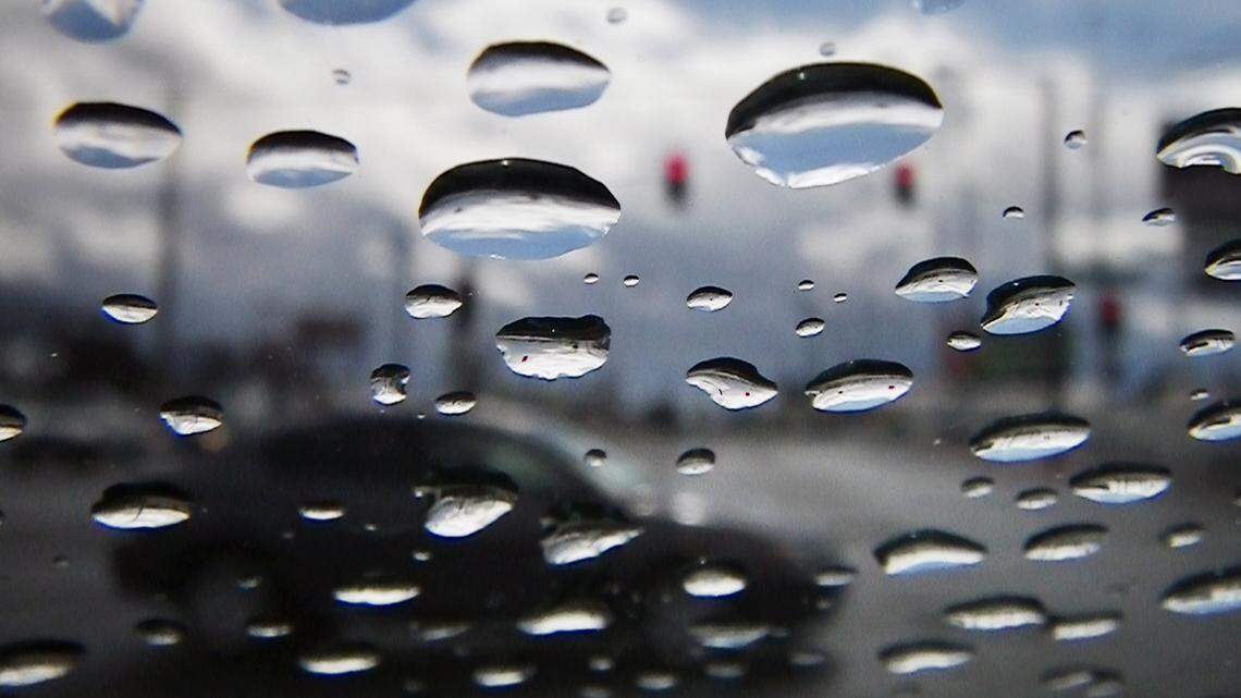 FRESNO, CA. 2/16/2011 MTD EPZ WILDART RAIN WINDSHIELD Raindrops cling to my windshield at a redlight along Blackstone Avenue Wednesday afternoon, February 16, 2011. (ERIC PAUL ZAMORA-THE FRESNO BEE)