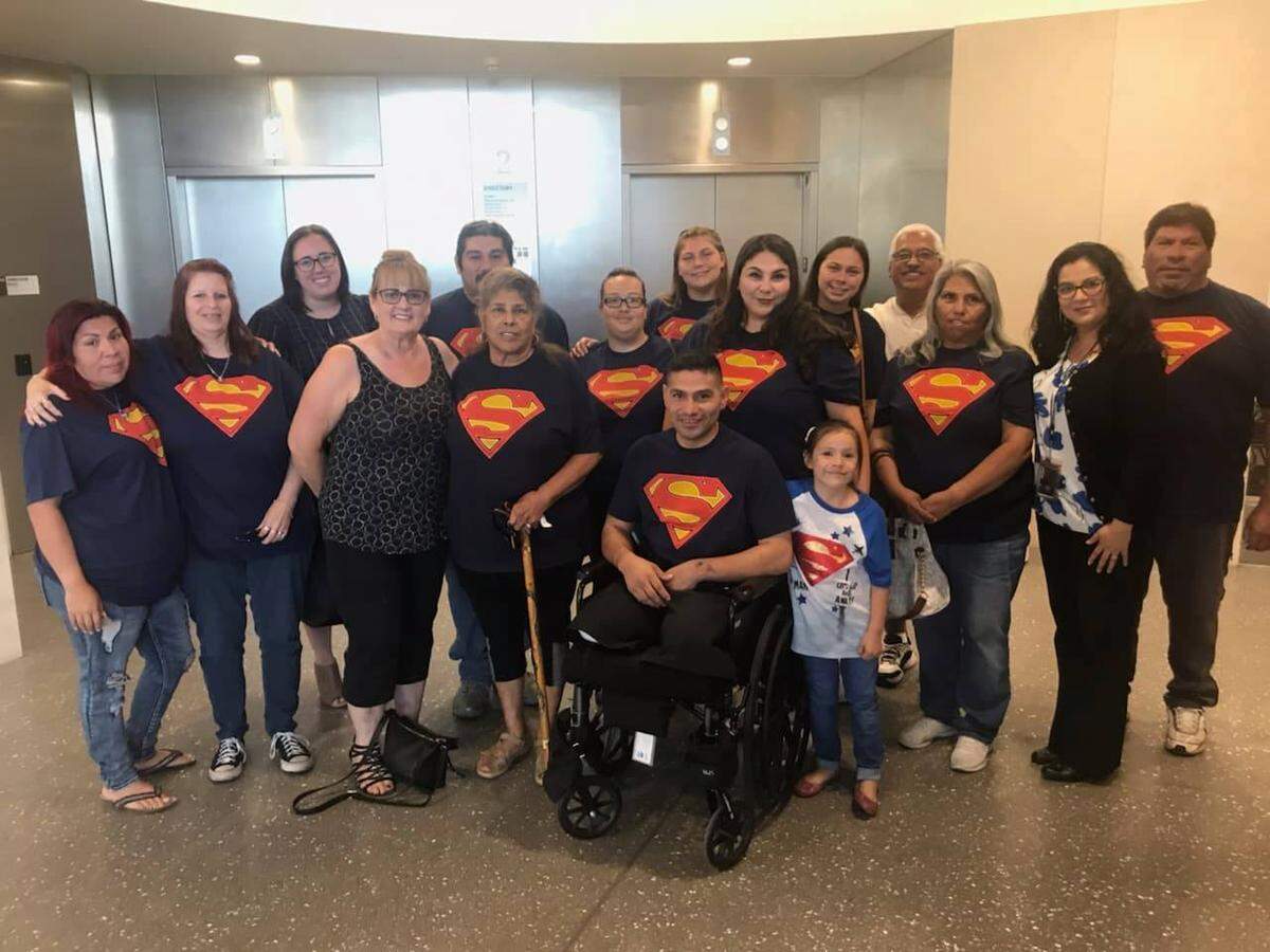 Geronimo Gonzalez, in a wheelchair, is surrounded by family as he recovers from injuries caused by a drunken driver on April 12, 2019. Mohamed Mohamed was sentenced to nine years in prison for the crash.
