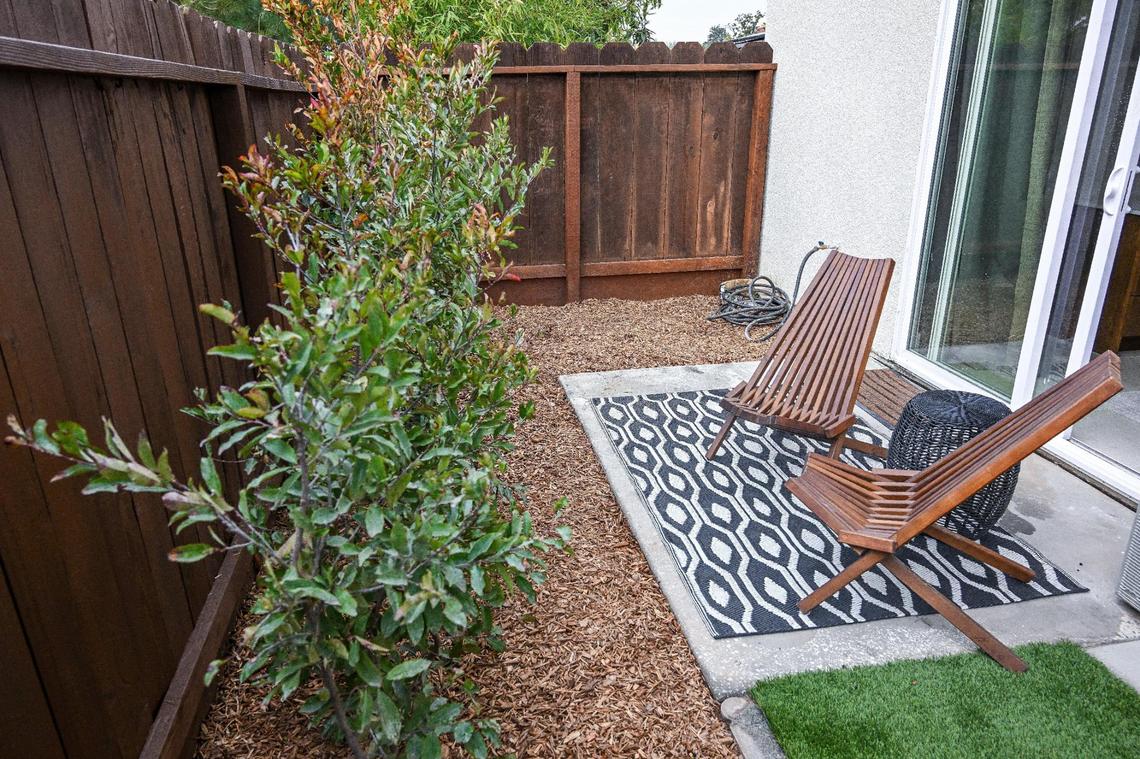 A tiny backyard space is shown at a recently completed accessory dwelling unit or ADU sitting adjacent to a house on a lot in Fresno neighborhood. Property owner Brandon Telesmanic had the home built as a rental property which is a growing trend in Fresno.