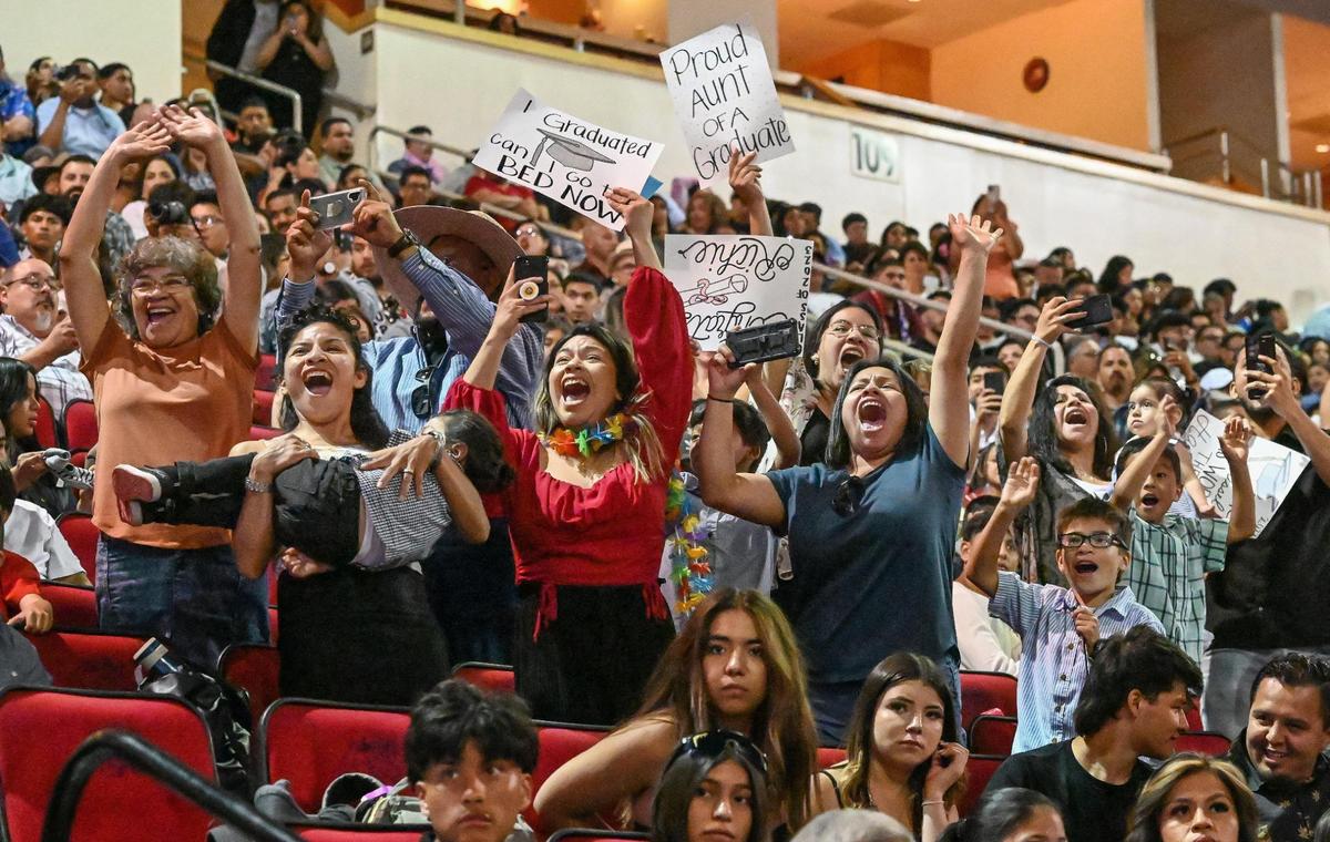 Family and friends cheer for graduates during the 47th annual Fresno State Chicano/Latino Commencement Celebration at the Save Mart Center on Saturday, May 20, 2023.