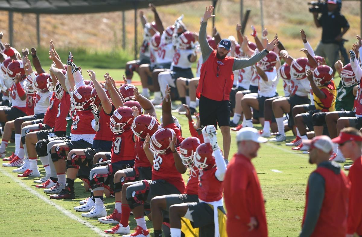 The Fresno State Bulldogs stretch at the start of their first football practice Friday, Aug. 3, 2018 in Fresno. The Bulldogs return 17 starters from a 10-4 team and were picked to win the West Division in the Mountain West Conference in a preseason media poll.