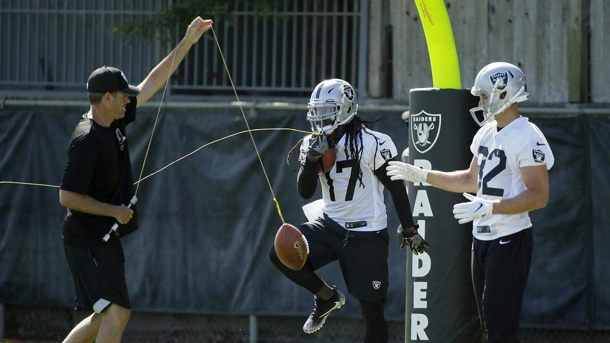 Oakland Raiders wide receivers Dwayne Harris (17) and Jordy Nelson, right, take part in a drill during NFL football practice in Napa, Calif., Friday, July 27, 2018.