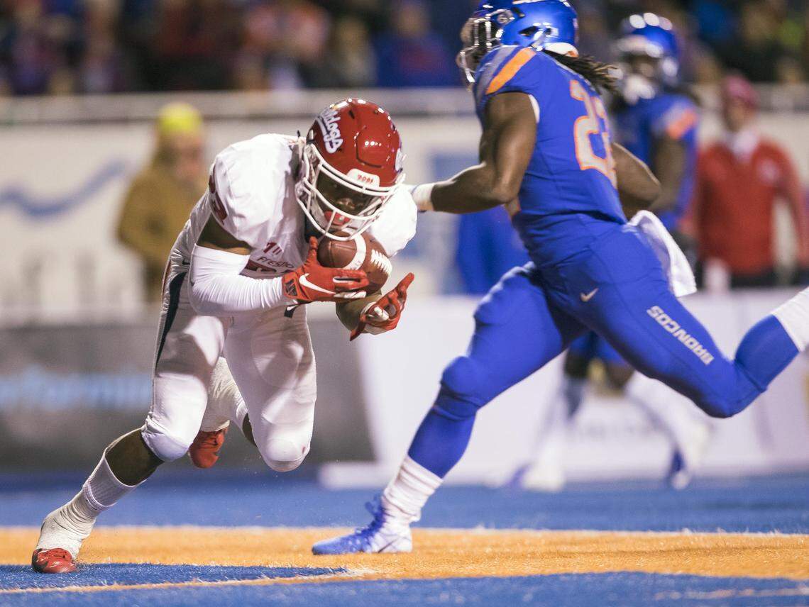 Fresno State defensive back Juju Hughes (23) intercepts a pass intended for Boise State running back Alexander Mattison (22) last season in a 24-17 loss to the Broncos Nov. 9, 2018.