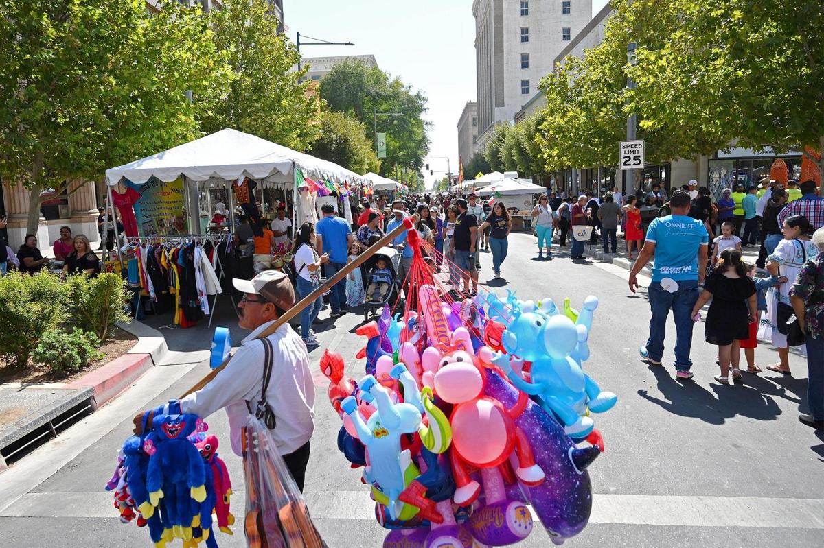 Booths and vendors lined Fulton Street in downtown Fresno for the Fiestas Patrias parade and festival, celebrating Mexican Independence Day and more, on Saturday, Sept. 17, 2022.