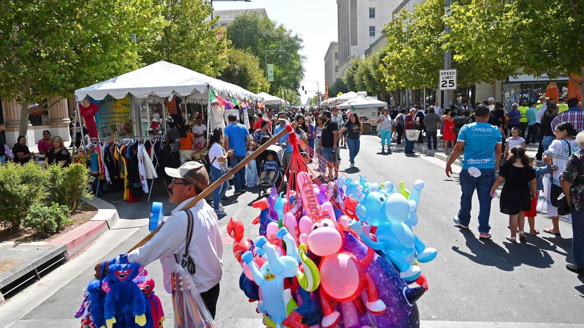 Booths and vendors lined Fulton Street in downtown Fresno for the Fiestas Patrias parade and festival, celebrating Mexican Independence Day and more, on Saturday, Sept. 17, 2022.