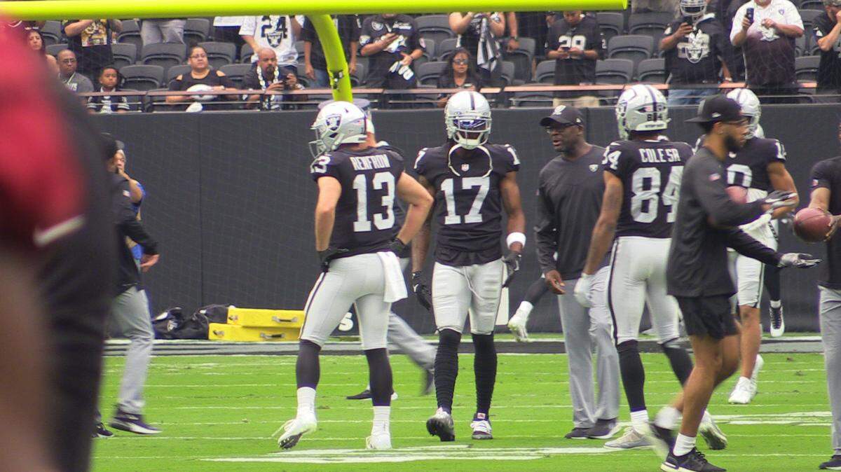 Davante Adams and the Las Vegas Raiders before an NFL game in 2022.