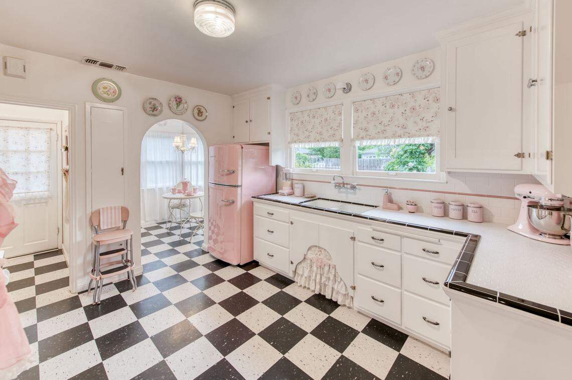 The kitchen of this storybook Tudor cottage, 304 East Simpson Ave. in Fresno, features pink appliances. It’s on the market for $455,000.