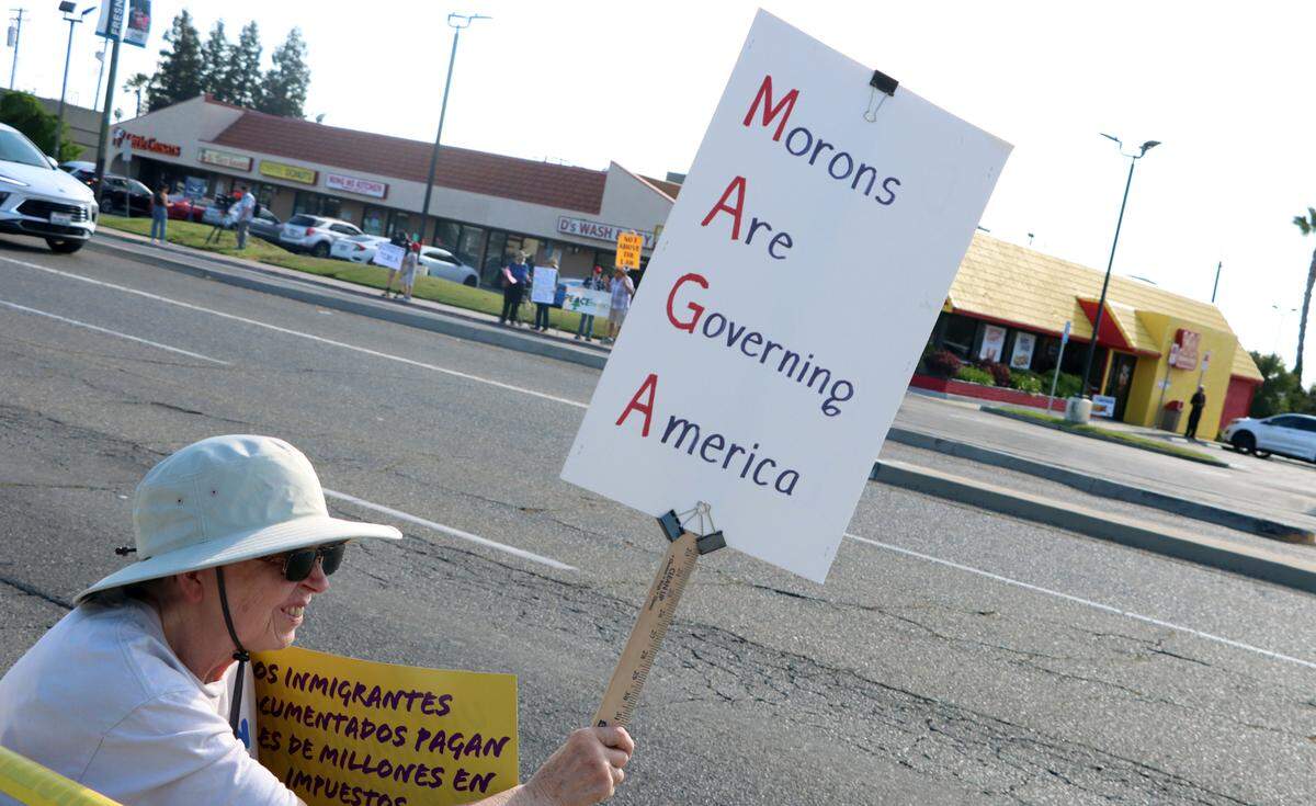 Several hundred protesters showed up on Blackstone near Alluvial in northeast Fresno to voice their opposition to various Trump administration actions on May 1, 2025.