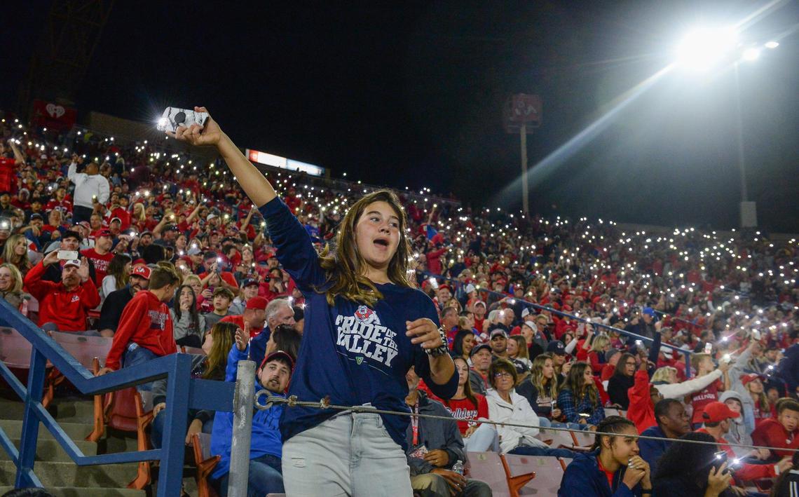 Fresno State fans turn on their cell phone lights at the beginning of the fourth quarter of a sell-out game against Boise State at Bulldog Stadium on Saturday, Nov. 6, 2021.