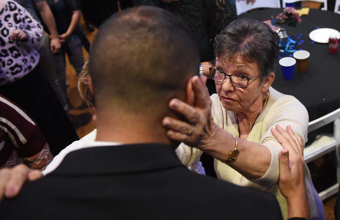 Kay Davies, right, consoles Andrew Janz as he walks out of the election night gathering Tuesday night, Nov. 6, 2018 in Fresno.