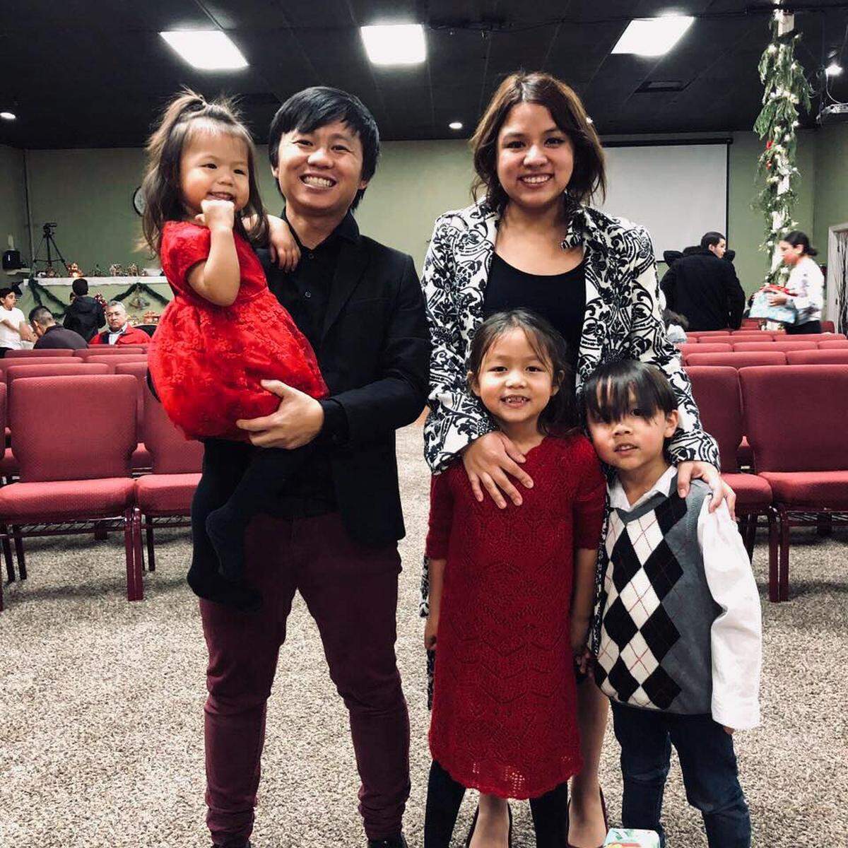 Tou and Stephanie Yang pose with their children, Loralei, 7, Emery, 5, and Jude, 2.