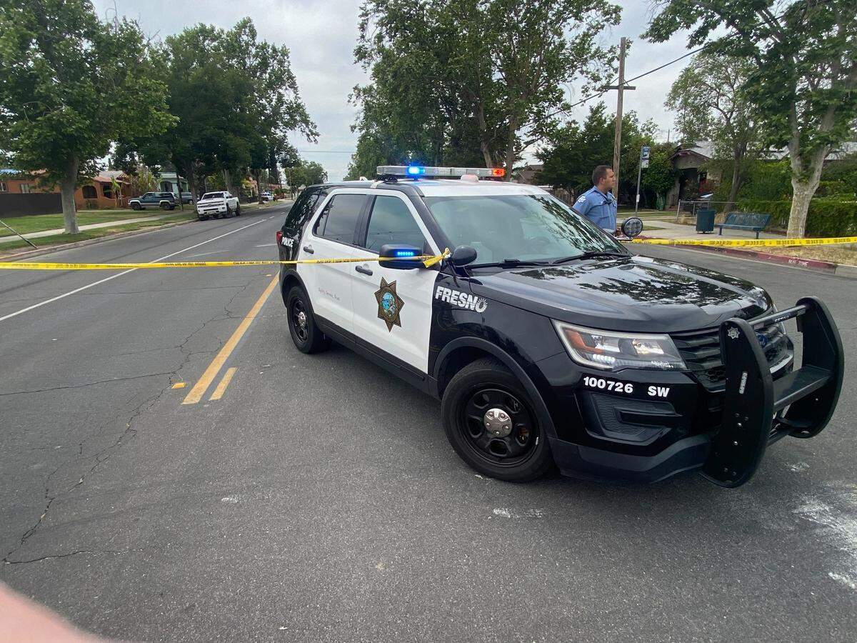 Police close the scene where a man was shot Tuesday afternoon, May 9, 2023, in Fresno, California.