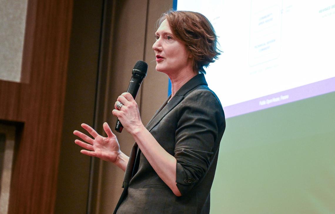 Margaret Cederoth, director of planning and sustainability for the California High-Speed Rail Authority, speaks to a crowd of interested parties during an informational open house by the High-Speed Rail Authority to discuss what is envisioned for the future Fresno Station at the Hilton DoubleTree in downtown Fresno on Wednesday, May 1, 2024.