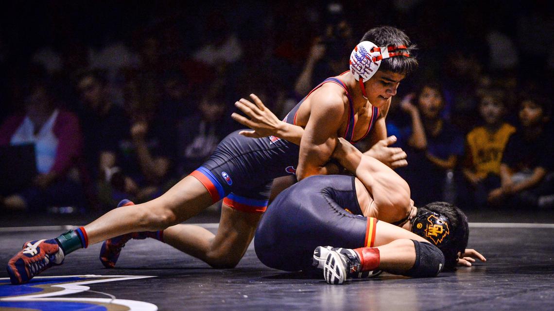 Buchanan’s Raymond Lopez, top, wrestles Michael Torres of Oakdale in the championship match for the 106-pound division during the Doc Buchanan Invitational wrestling tournament at Clovis High on Saturday, Jan 4, 2020. Lopez won the championship by pin.