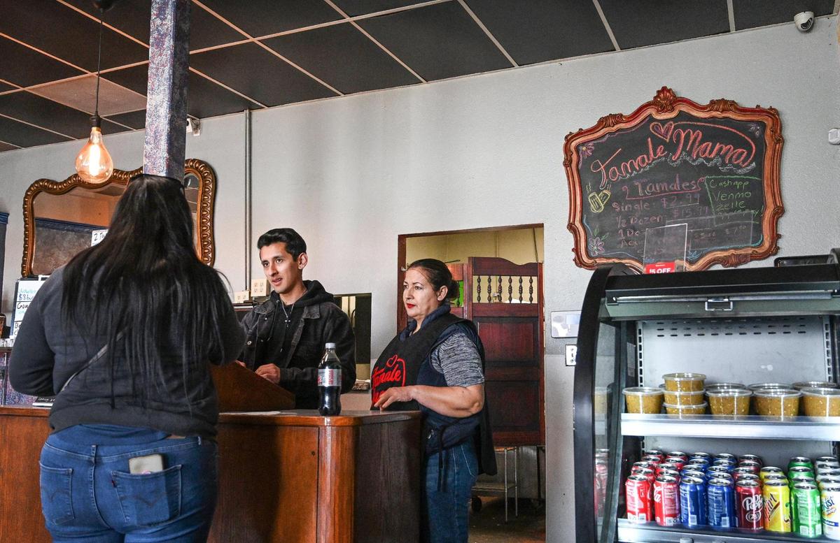Ruben Vazquez and his mother Cristina Leon work take an order at the new location of their restaurant Tamale Mama in Fresno’s Chinatown area on Wednesday, March 1, 2023.