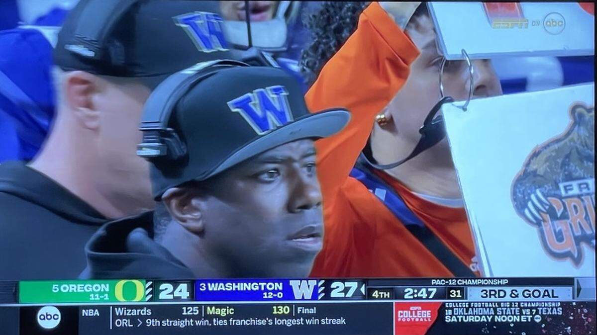 An old Fresno Grizzlies logo is shown on TV during the Pac-12 championship between Washington and Oregon in Las Vegas on Friday, Dec. 1, 2023.