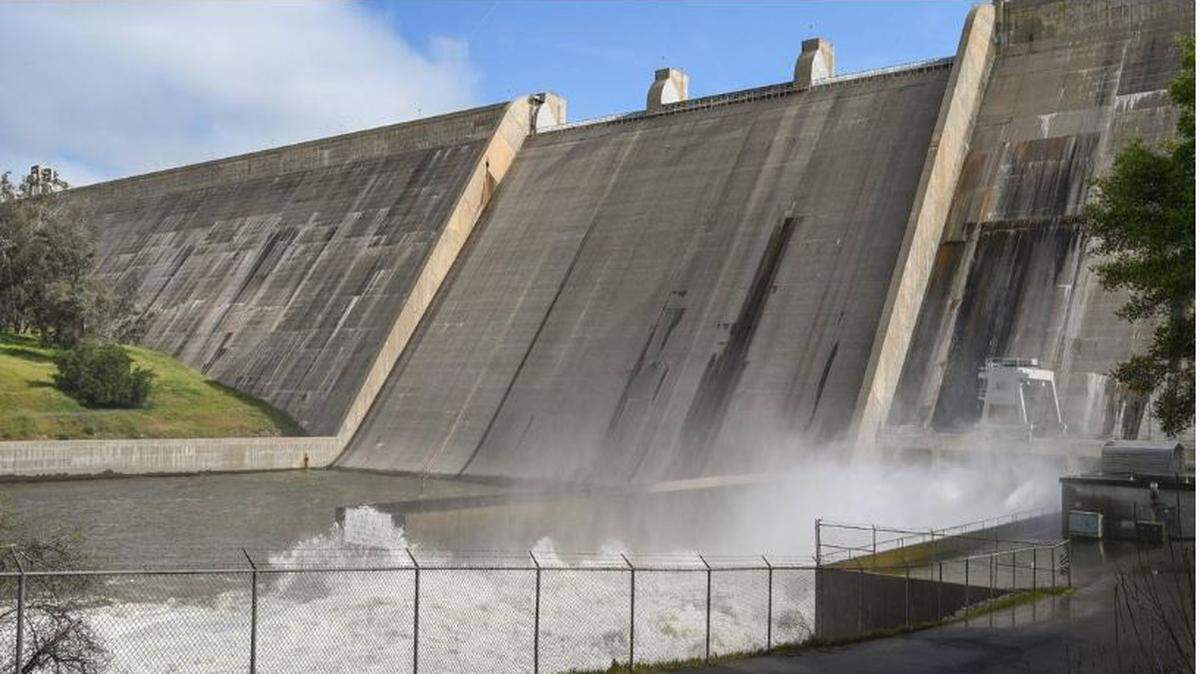 Water is released from the base of Friant Dam at a rate of more than 8,000 cubic feet per second on Tuesday, April 11, 2023 to make room in Millerton Lake for the expected spring and summer melt of the record snowpack in the Sierra Nevada. Officials are expecting the lake will fill to the top this spring, causing water to pour over the spillway causing more issues downstream. CRAIG KOHLRUSS ckohlruss@fresnobee.com