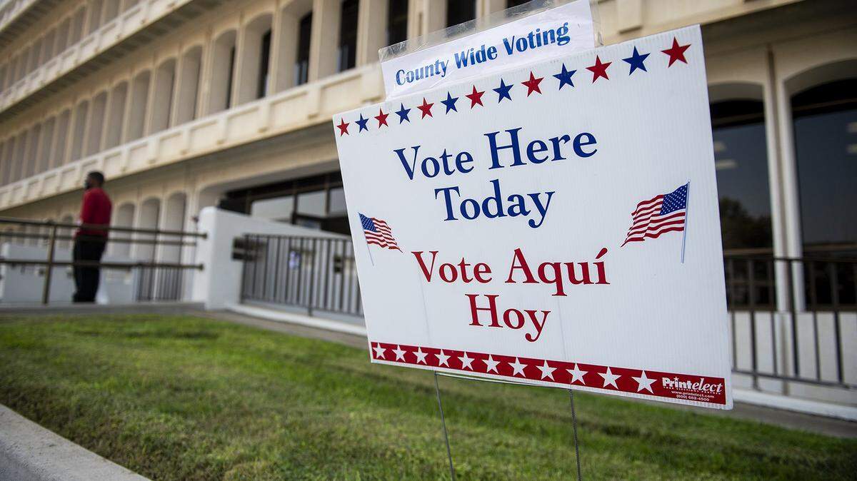 A sign directing people to vote at the location is seen outside the Merced County Building on M Street in Merced, Calif., on Tuesday, Nov. 3, 2020.