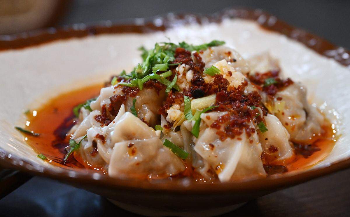 Sichuan Style Pork Wontons with pork and a little bit of shrimp sitting in chili oil, served at Dumpling U at Fresno Street and Alluvial Avenue. Photographed Wednesday, Jan. 28, 2026 in Fresno.